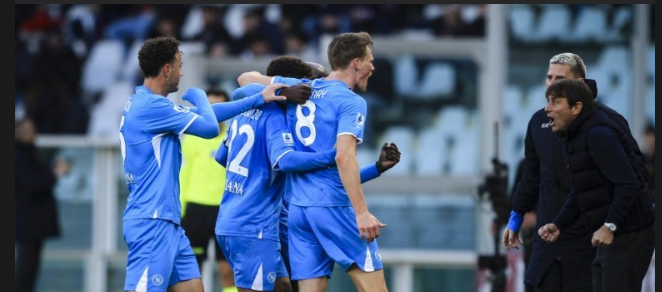 Napoli players celebrate with Conte